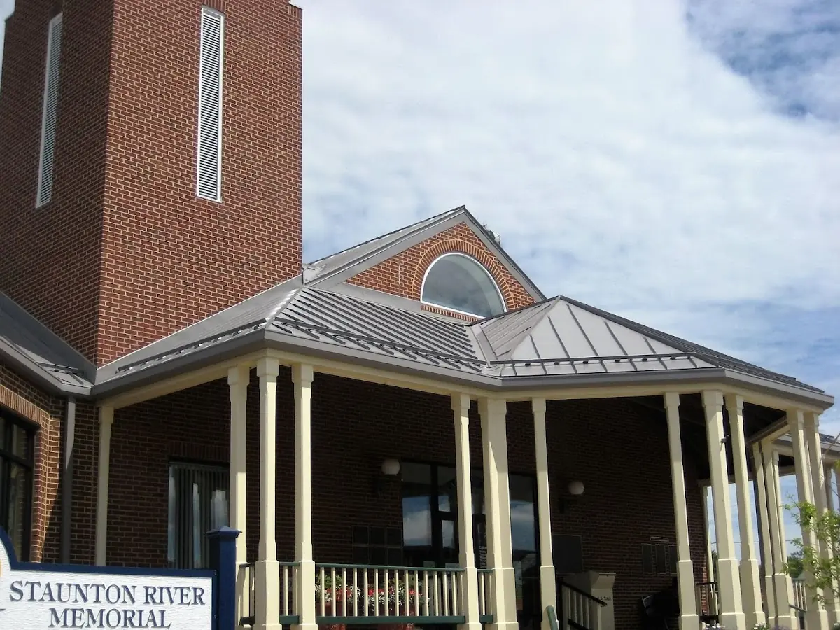 Skilled roofing craftsmen working on a residential roof in Berlinsville